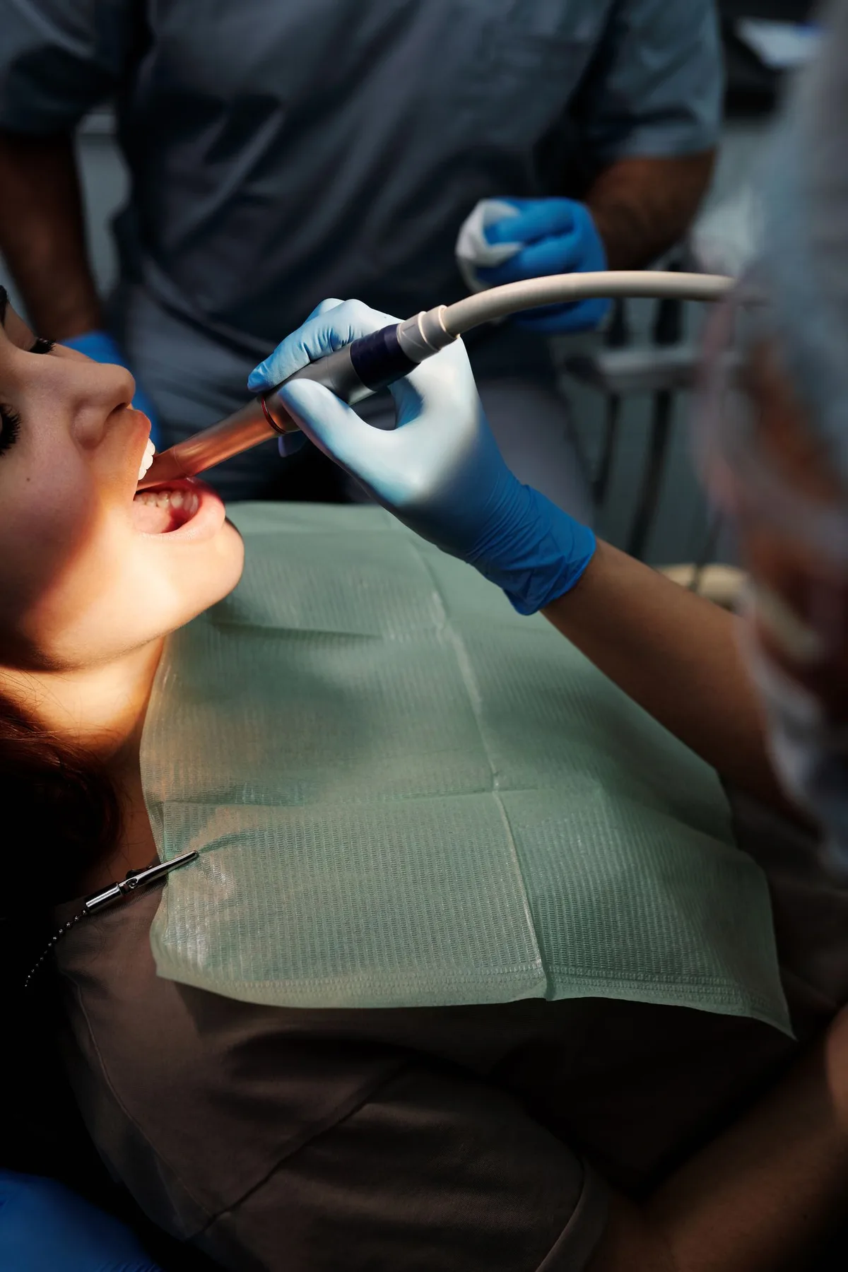 Dental procedure with instruments and gloved hands
